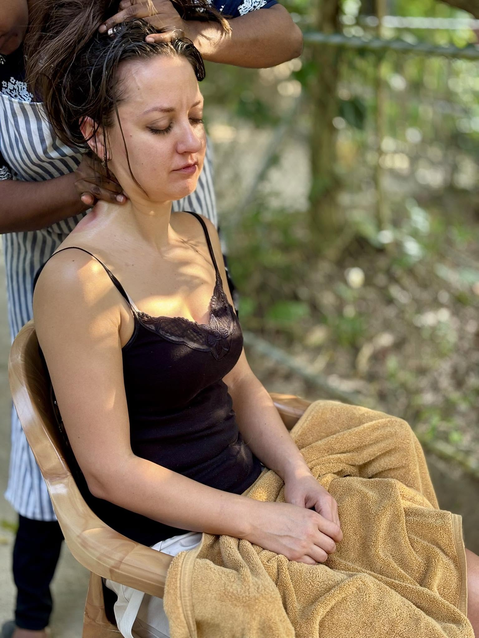 Guest relaxing during an Ayurvedic head massage