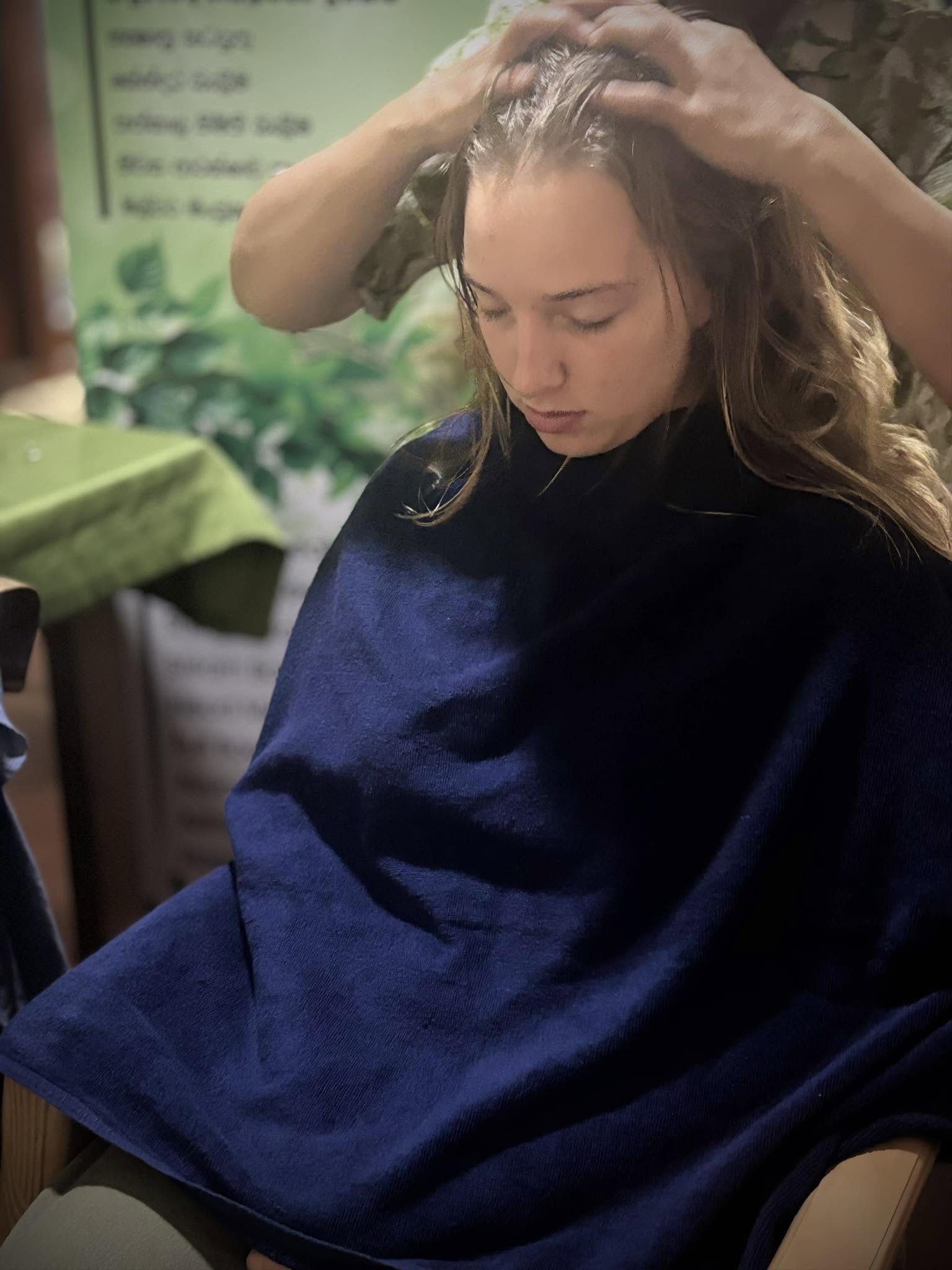 Guest enjoying a traditional Ayurvedic head massage